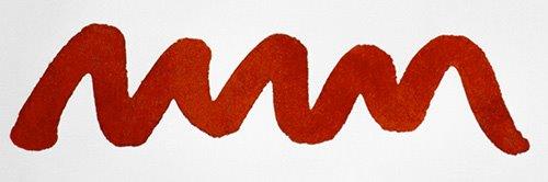 A colour swatch of Diamine Blood Orange fountain pen ink.