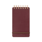 Dark Red MD Midori notebook with gold wire binding on a white background