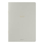 Single Midori A5 grey notebook with colour dot grid pages on a plain background.