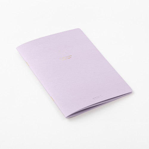 Single Midori A5 purple notebook with colour dot grid pages on a plain background.