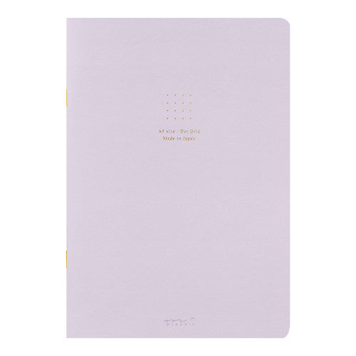 Single Midori A5 purple notebook with colour dot grid pages on a plain background.
