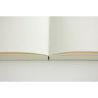 Single MD Notebook A5 with blank pages open on a plain background.
