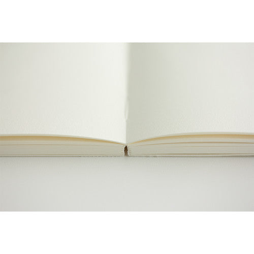 Single MD Notebook A5 with blank pages open on a plain background.