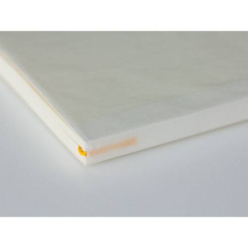 Single MD Notebook A5 showing yellow bookmark.