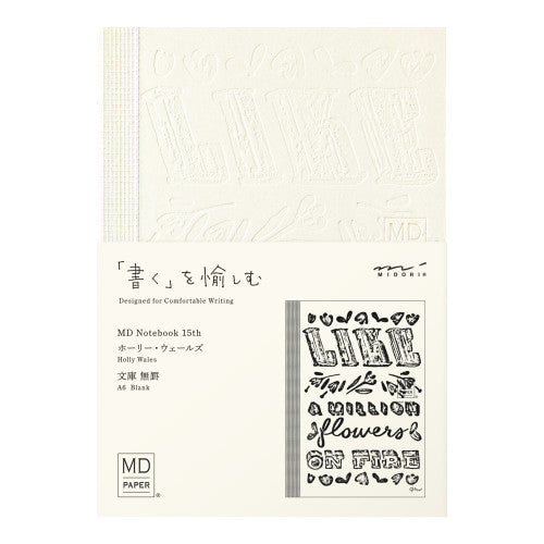 15th anniversary limited edition MD Notebook with embossed Holly Wales design, on a white background.