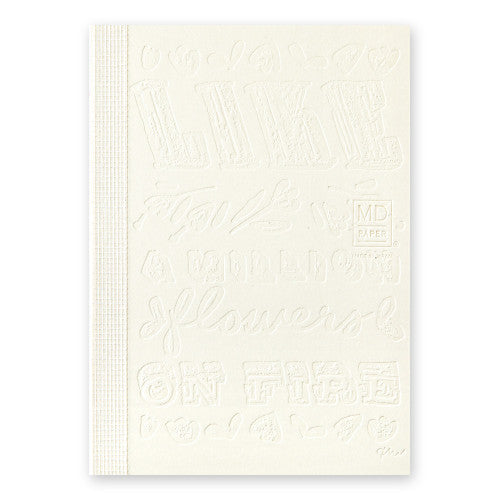 15th anniversary limited edition MD Notebook with embossed Holly Wales design, on a white background.