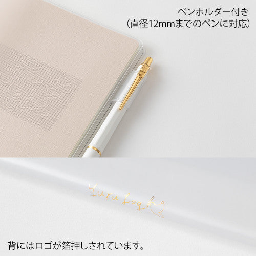 Clear Midori B6 Yuru Log Book cover with pen holder on a plain background.