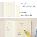 Single Midori A6 beige commonplace notebook on a plain background displayed flat.
