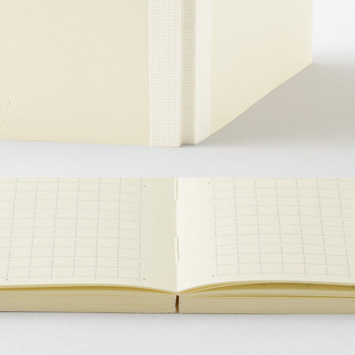 Open MD Paper Journal with Grid B design on pages, on a white background.