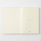 MD Notebook A5 with Dot Grid Pages  opened on first page on a white background.