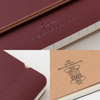 Dark Red MD Midori notebook on a white background