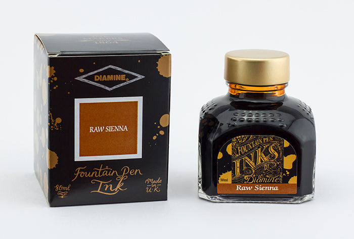 A glass bottle of 80ml Diamine Raw Sienna fountain pen ink next to its packaging box, in front of a white background.