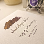 A colour writing swatch of Diamine Deck the Halls chameleon fountain pen ink.