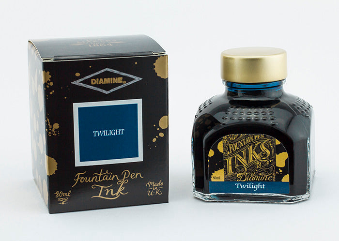 A glass bottle of 80ml Diamine Twilight fountain pen ink next to its packaging box, in front of a white background.