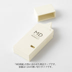 MD Paper company product "writing correction tape" in cream colour on white background.