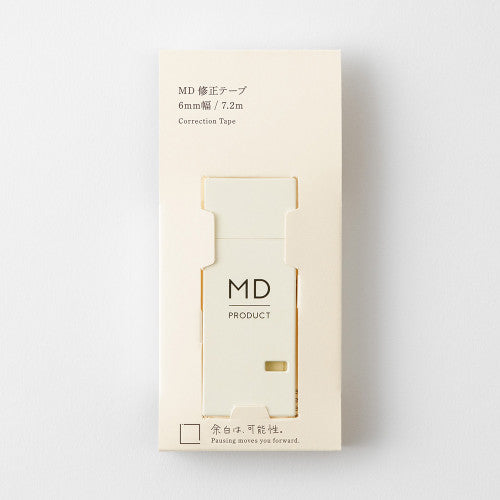 MD Paper company product "writing correction tape" in cream colour on white background.