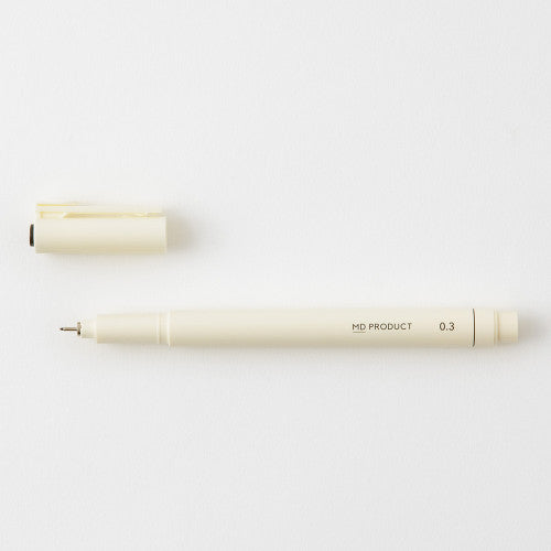 MD drawing pen with cap off on a white background.