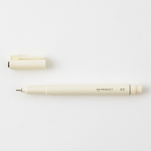MD drawing pen with cap off on a white background.