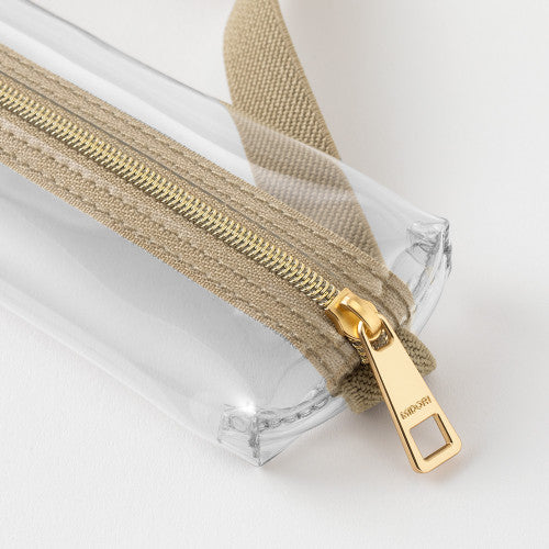 Close up of zip on Midori Book Band Pen Case in Beige and Clear, on a white background.