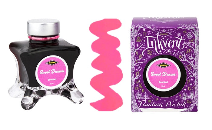 A glass bottle of 50ml Diamine Purple Edition Inkvent Sweet Dreams scented fountain pen ink next to colour swatch and its packaging box, in front of a white background.