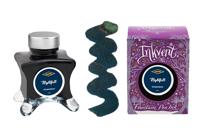 A glass bottle of 50ml Diamine Purple Edition Inkvent Nightfall chameleon fountain pen ink next to colour swatch and its packaging box, in front of a white background.