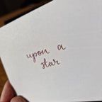 A colour swatch of Diamine Upon a Star chameleon fountain pen ink.