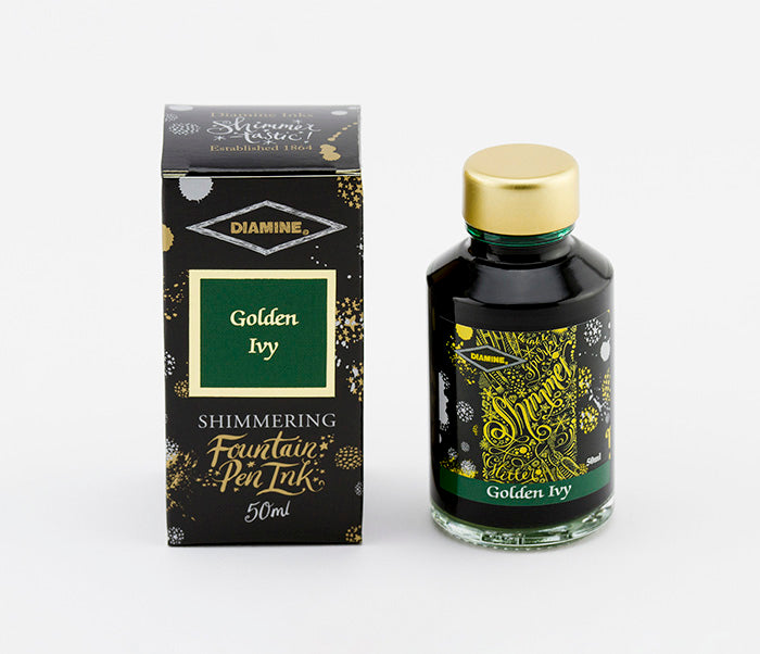 A glass bottle of 50ml Diamine Golden Ivy shimmering fountain pen ink next to its packaging box, in front of a white background.