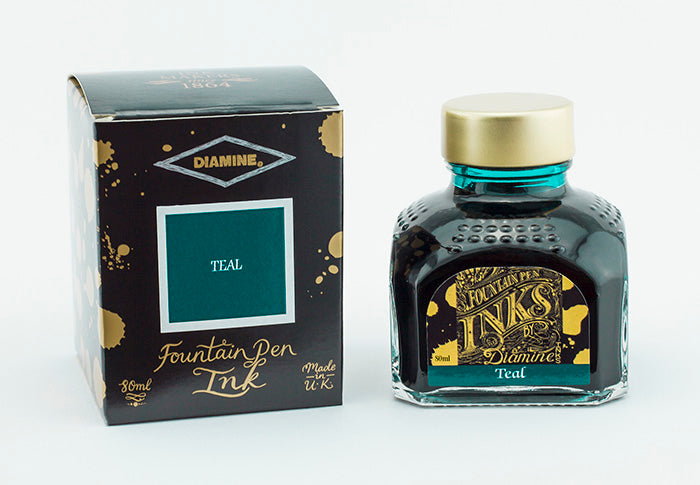 A glass bottle of 80ml Diamine Teal fountain pen ink next to its packaging box, in front of a white background.