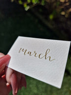 A colour writing swatch of Diamine Olive Swirl chameleon fountain pen ink.