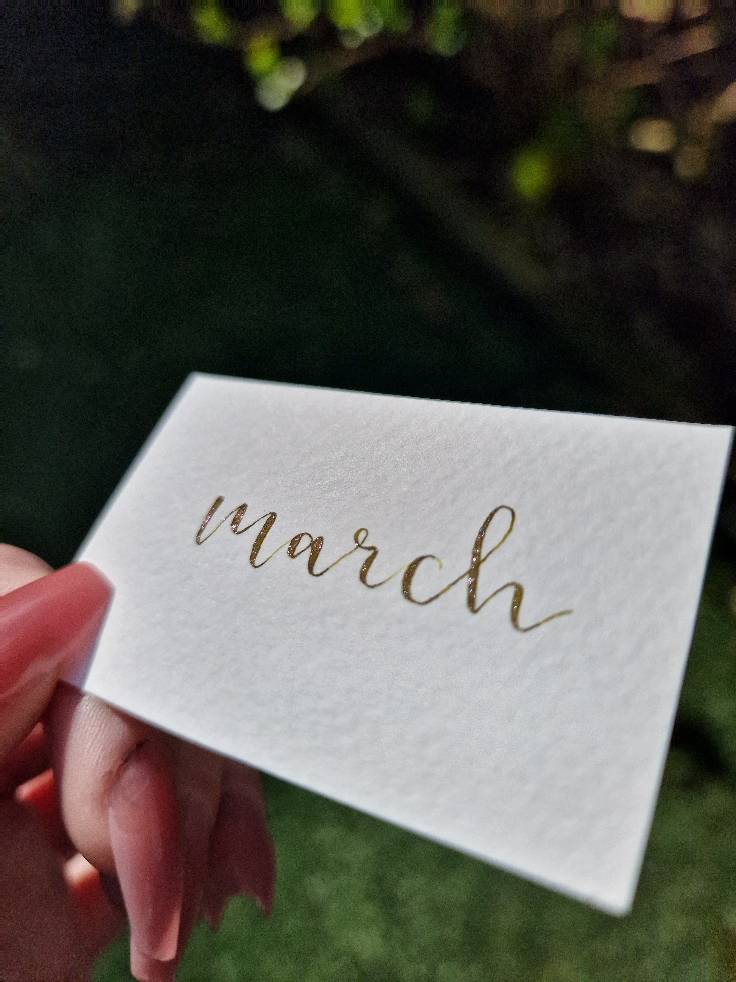 A colour writing swatch of Diamine Olive Swirl chameleon fountain pen ink.