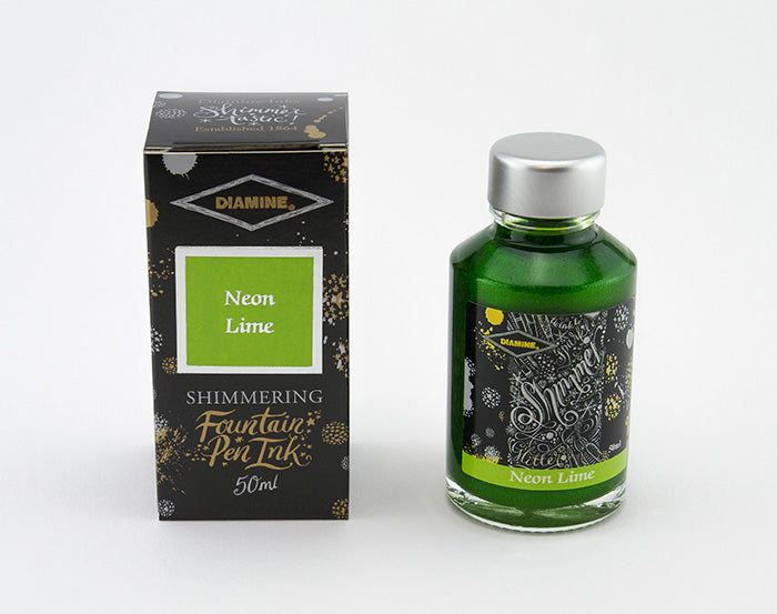 A glass bottle of 50ml Diamine Neon Lime shimmering fountain pen ink next to its packaging box, in front of a white background.