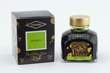 Load image into Gallery viewer, A glass bottle of 80ml Diamine Jade Green fountain pen ink next to its packaging box, in front of a white background.
