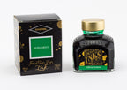 A glass bottle of 80ml Diamine Ultra Green fountain pen ink next to its packaging box, in front of a white background.