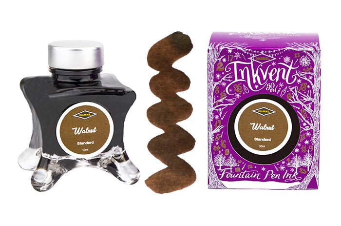 A glass bottle of 50ml Diamine Purple Edition Inkvent Walnut fountain pen ink next to colour swatch and its packaging box, in front of a white background.