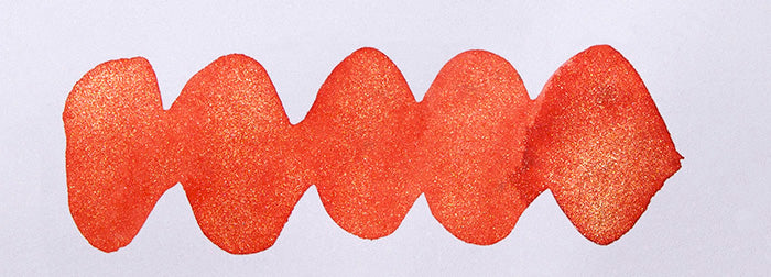 A colour swatch of Diamine Celebration shimmer fountain pen ink.