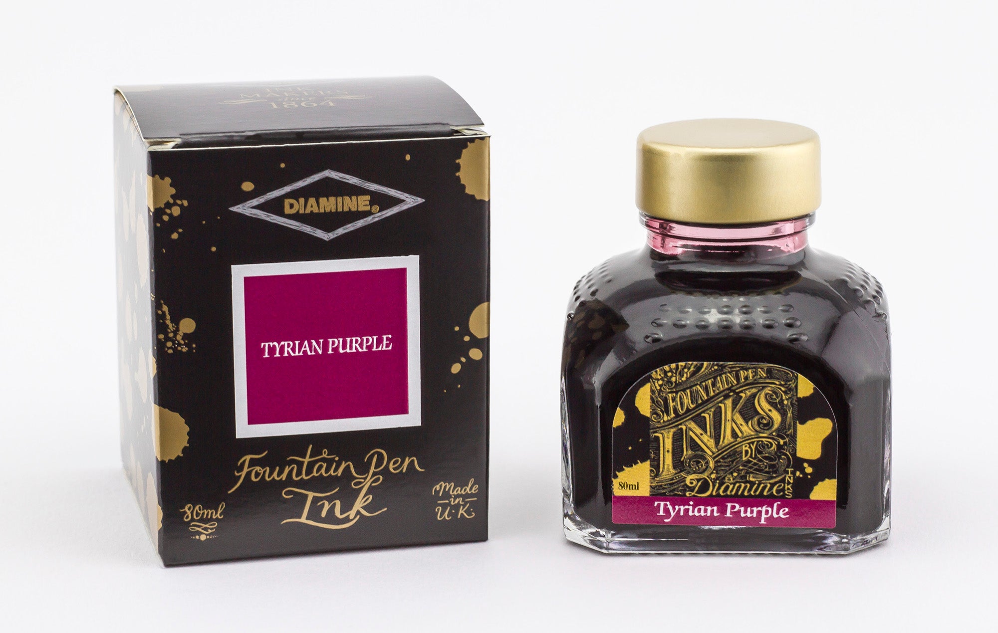 A glass bottle of 80ml Diamine Tyrian Purple fountain pen ink next to its packaging box, in front of a white background.