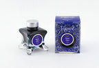 A glass bottle of 50ml Diamine Blue Edition Inkvent Festive Cheer sheening fountain pen ink next to packaging box, in front of a white background.