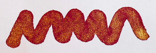 A colour swatch of Diamine Red Lustre shimmering fountain pen ink.